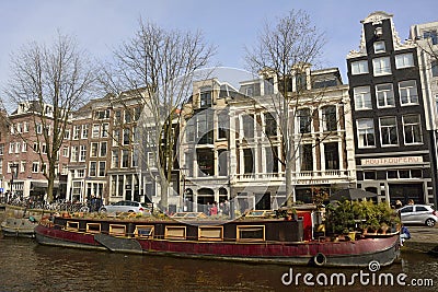 Houseboat along Prinsengracht canal in Amsterdam Editorial Stock Photo